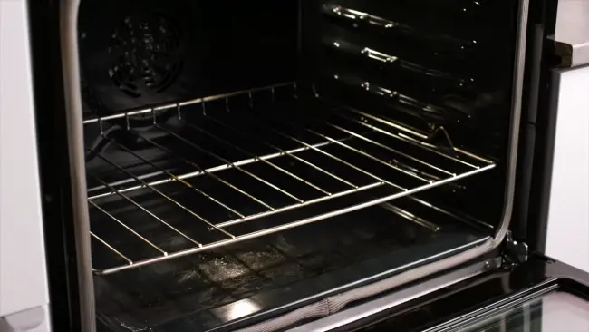 How long should you let your oven sit after cleaning the fire extinguisher residue