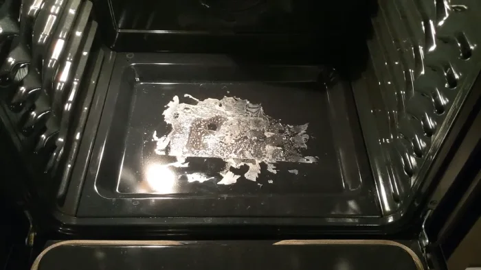 how to clean melted plastic from oven